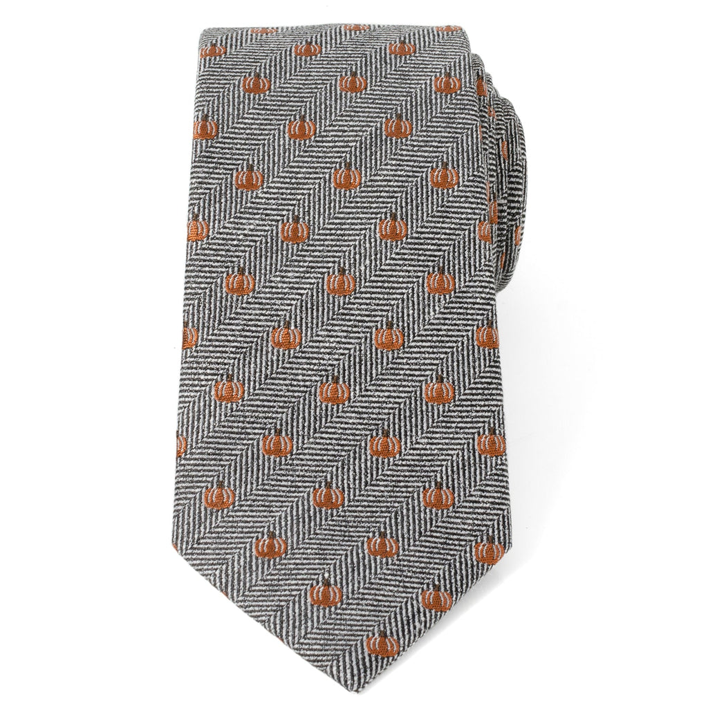 Gray herringbone necktie with repeating orange pumpkin motifs and pointed tip.