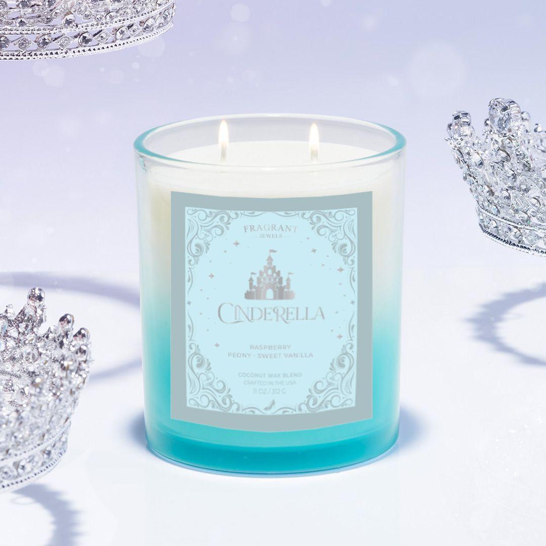 Blue wax jewel candle in frosted glass with lit wicks and silver tiara piece