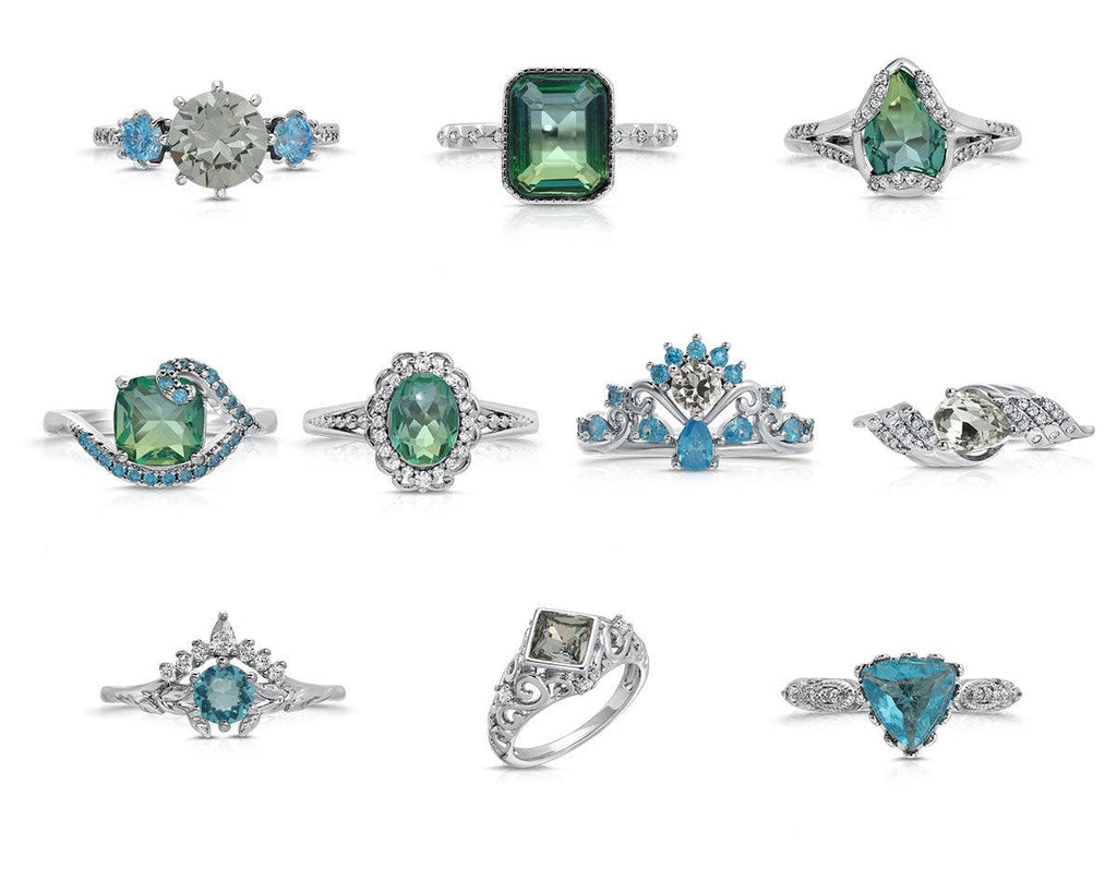 Assorted teal and blue gemstone rings with silver-tone settings