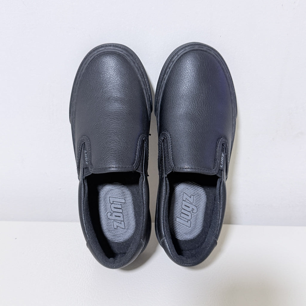 Black slip-on work shoes, front view with dual pull-on tabs