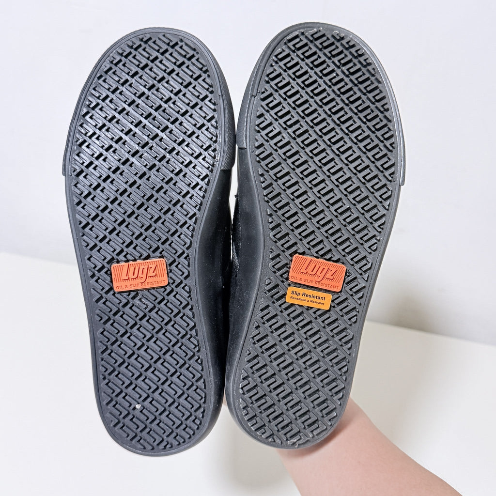 Black slip-resistant outsole with Lugz logo badge and patterned tread