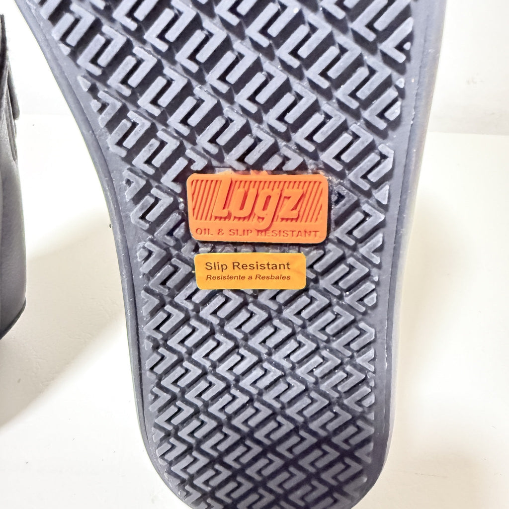 Textured slip-resistant tread with orange Lugz badge and grid pattern