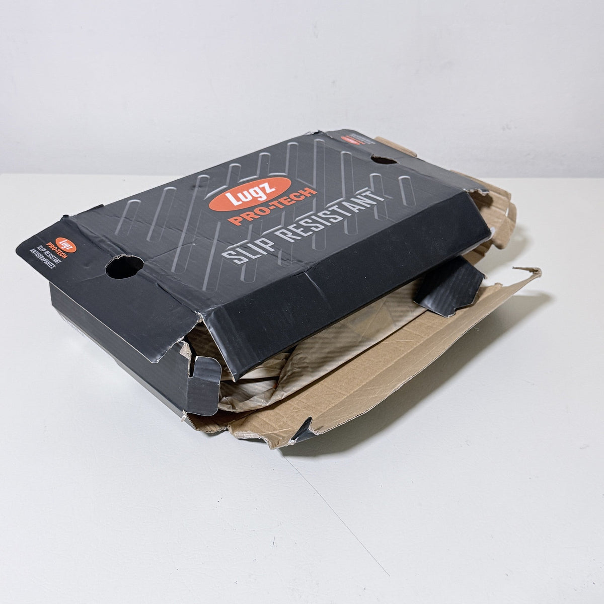Lugz ProTech slip resistant work shoe box label over black shoe