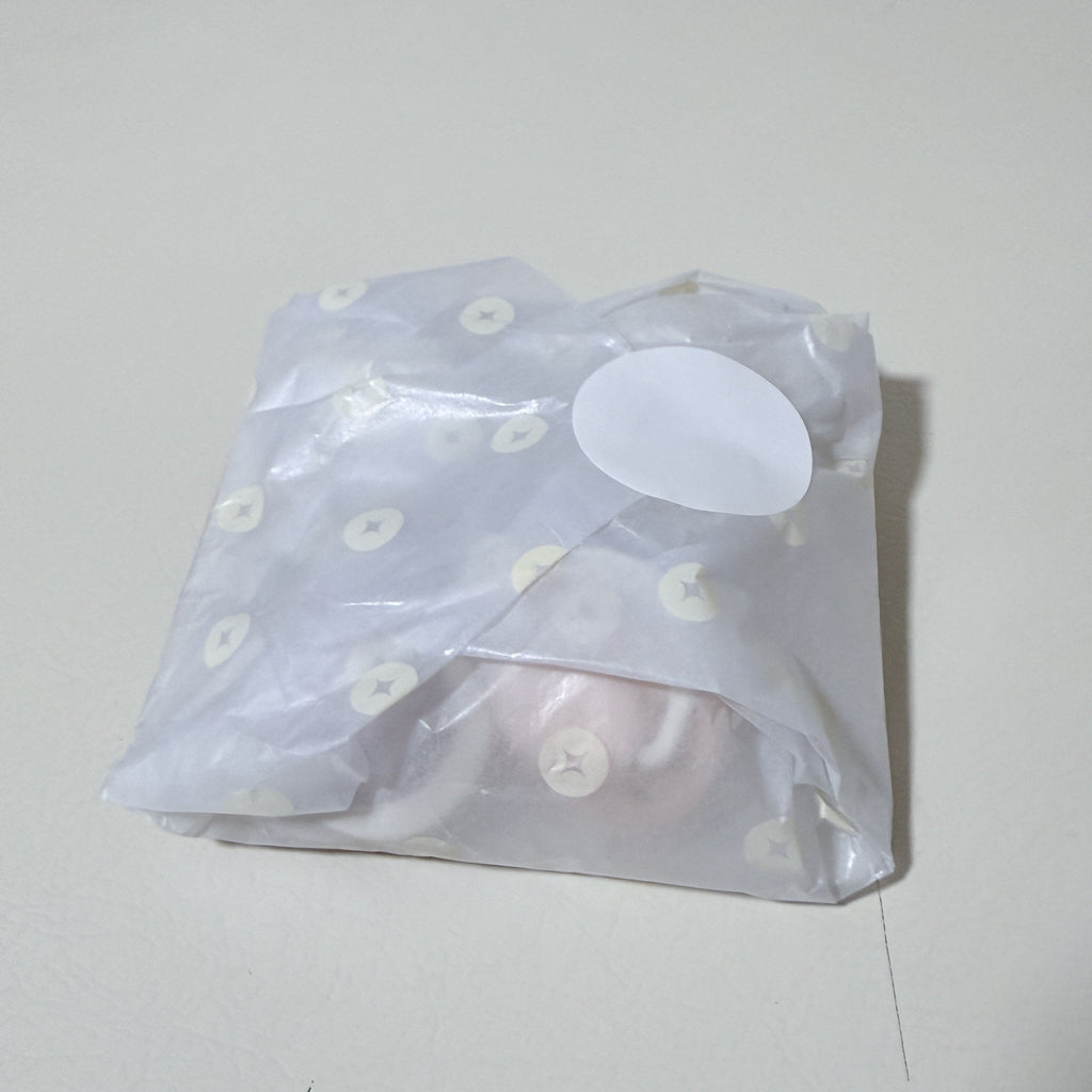 Wrapped newborn pacifier set in light blue with star pattern, silicone shields inside