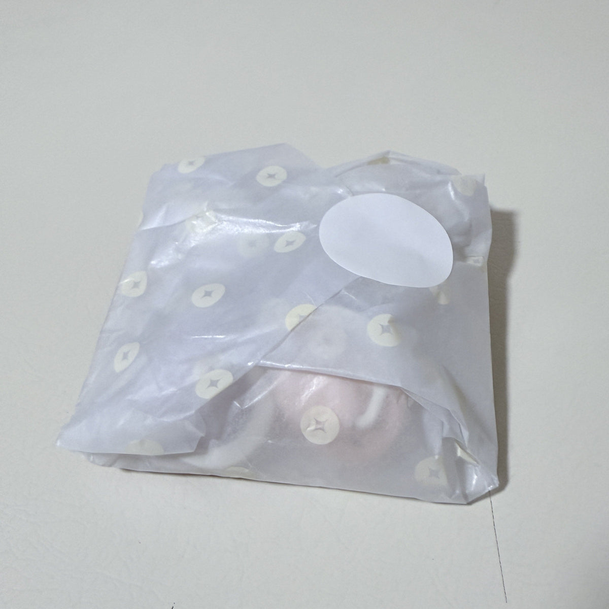 Wrapped newborn pacifier set in light blue with star pattern, silicone shields inside