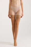 Nude sheer stockings with lace upper band and silicone grip, full length view