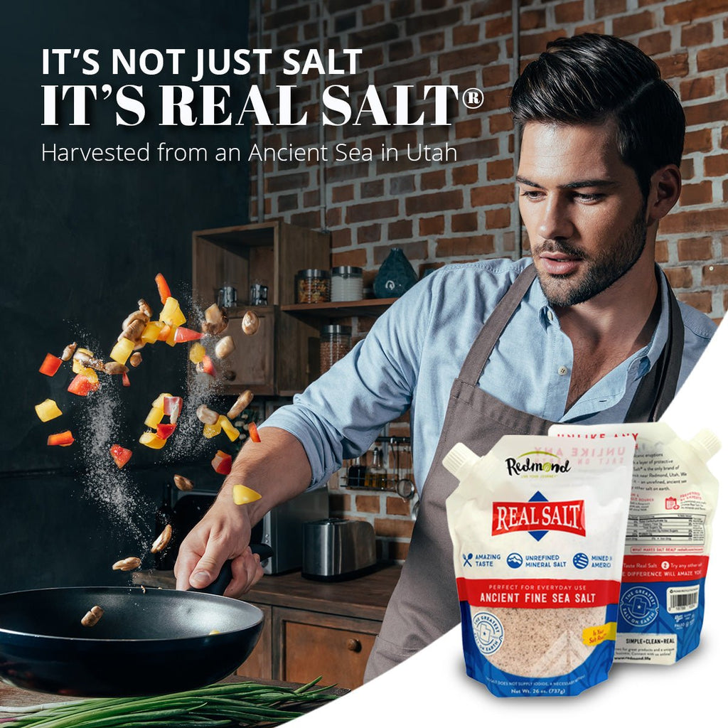 Redmond Real Salt fine-ground salt pouch held near cooking in kitchen