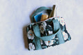 Floral lunch tote bag with blue and black fabric, open top showing inner pockets