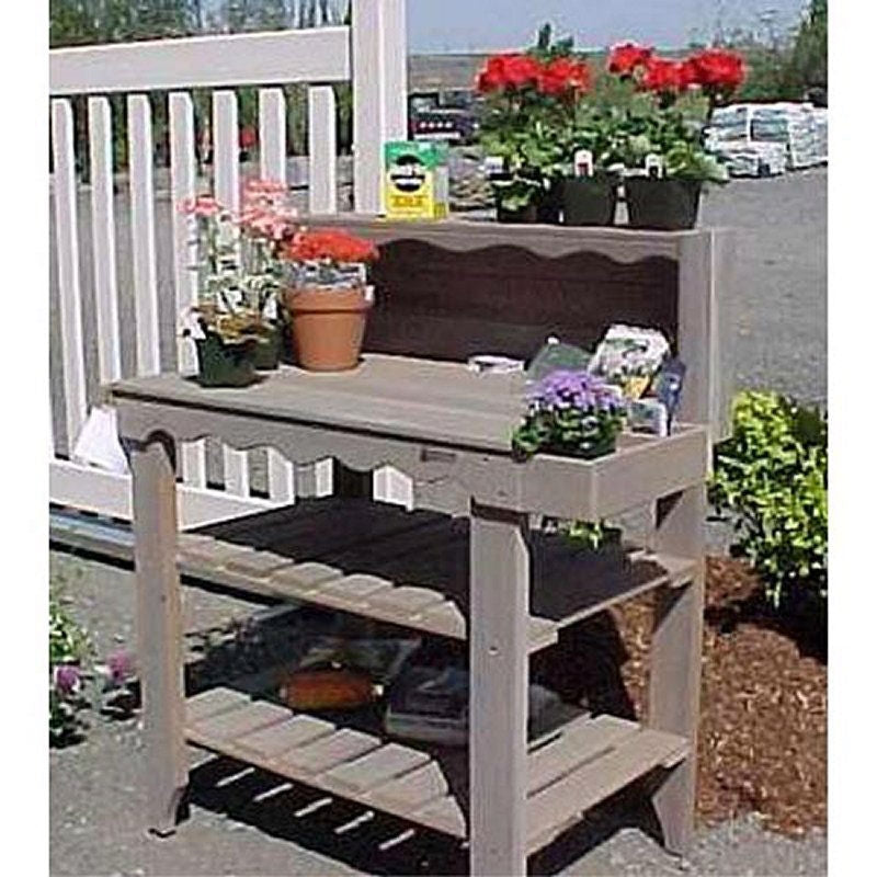Outdoor cedar wood potting bench with two shelves and side slats