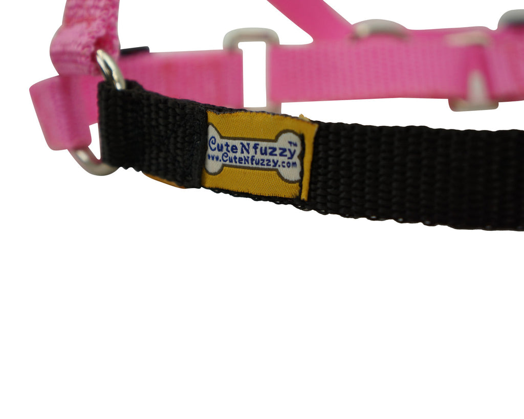 Pink and black Comfort Walk dog harness close-up with brand label patch