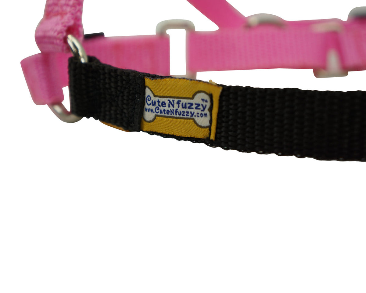Pink and black Comfort Walk dog harness close-up with brand label patch
