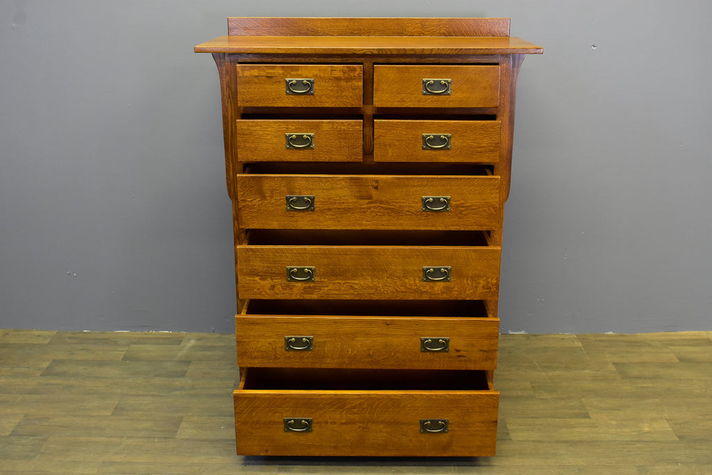 Mission-style 8-drawer dresser in warm wood finish with black cup pulls