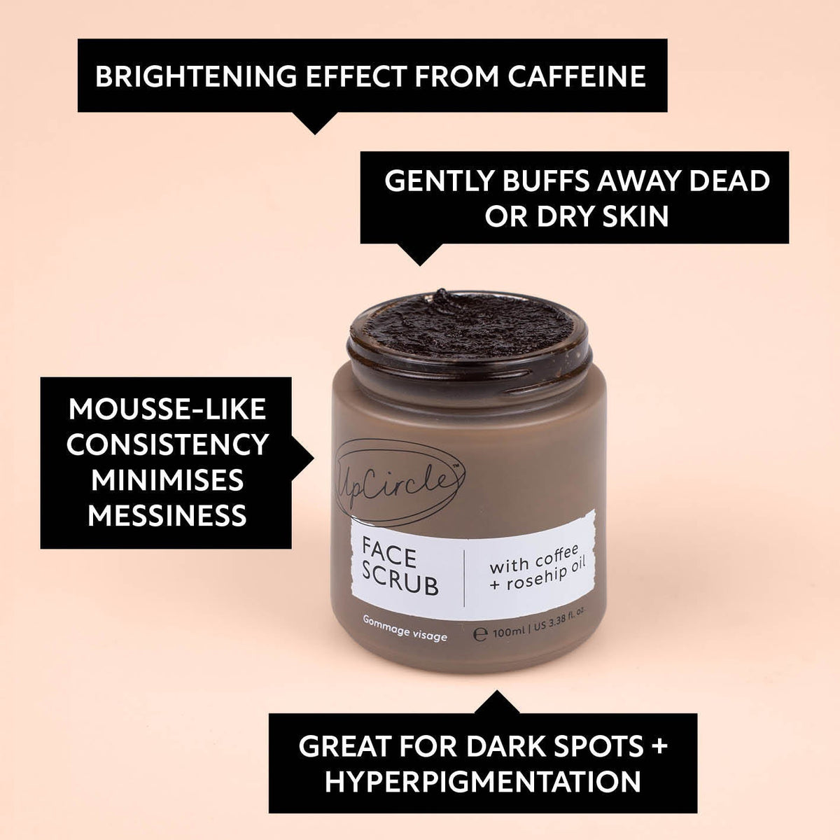 Face scrub jar with dark scrub mounded on lid opening