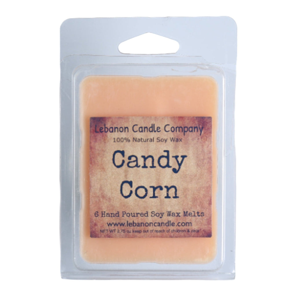 Candy corn wax melt package with pale orange soy wax bar inside
