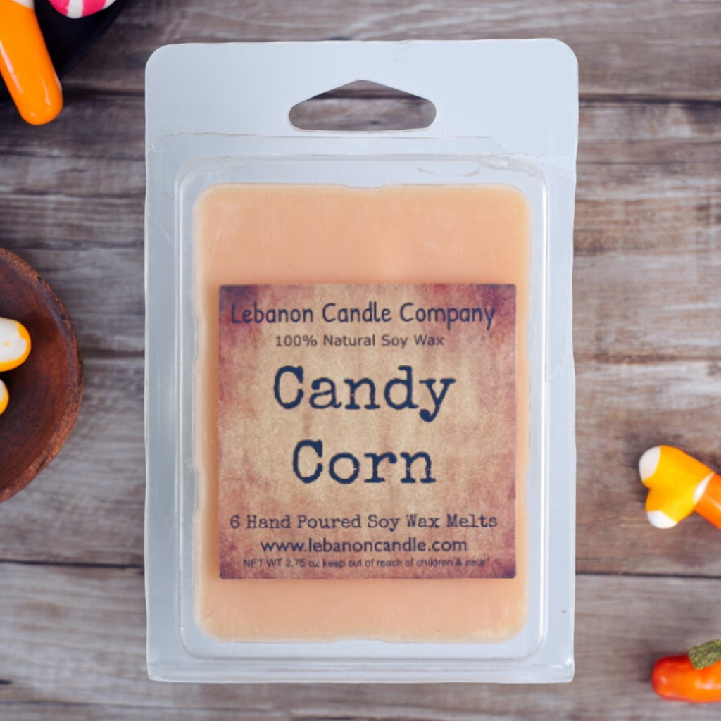 Candy corn wax melt bar in white retail clamshell, pale orange soy wax