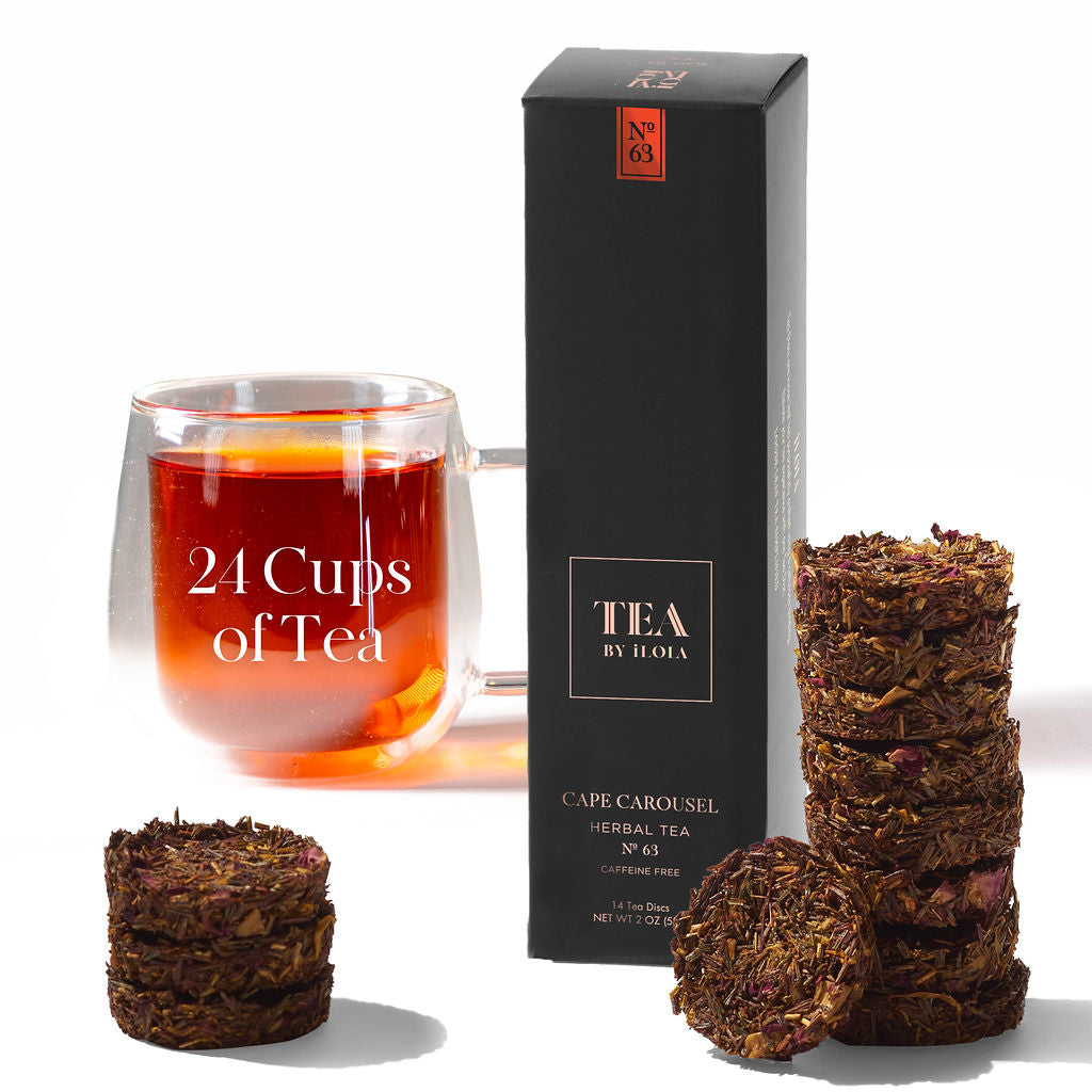 Cape Carousel No. 63 herbal tea box and discs beside a cup of amber tea