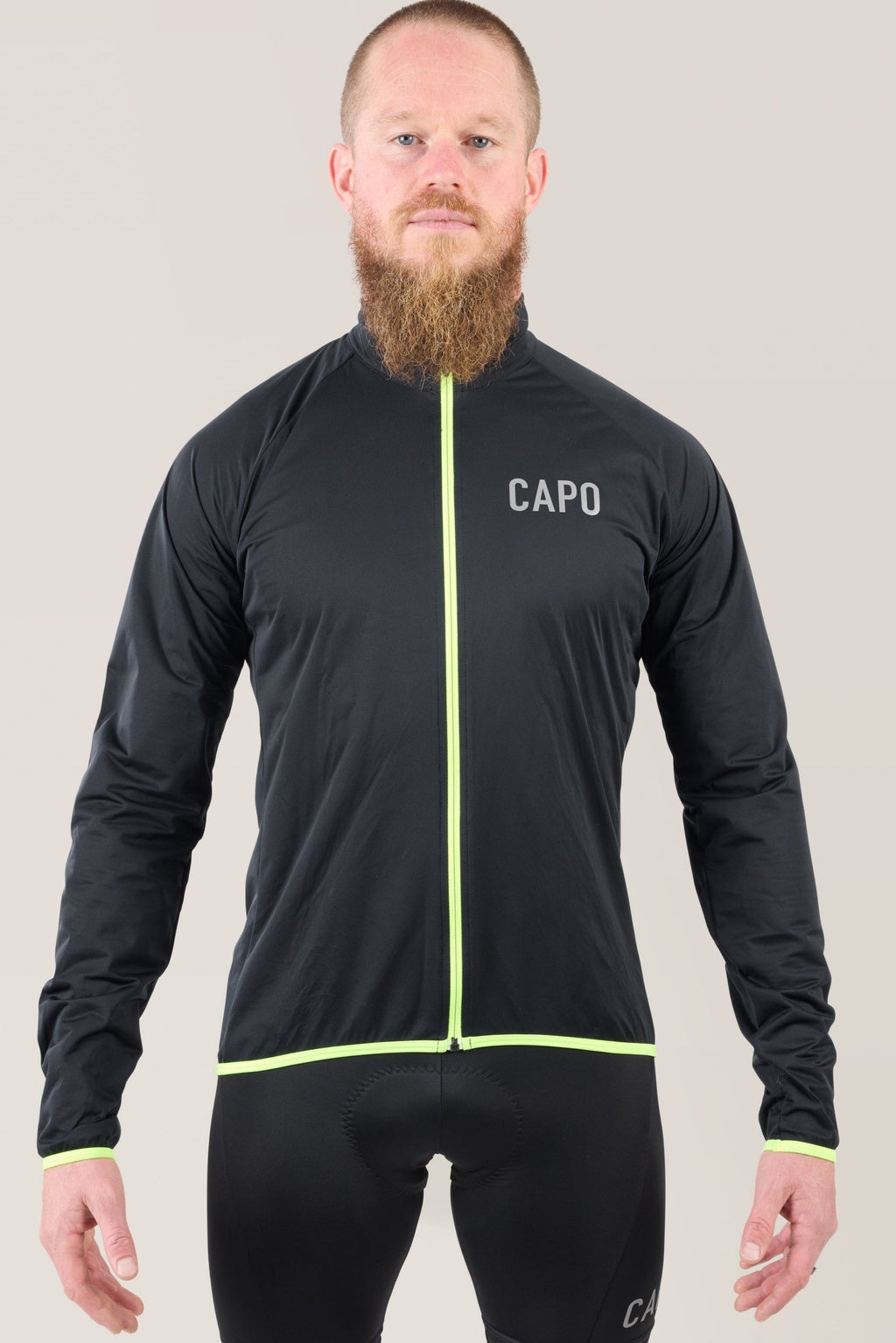Black rain jacket with neon lime zipper and trim, full front view
