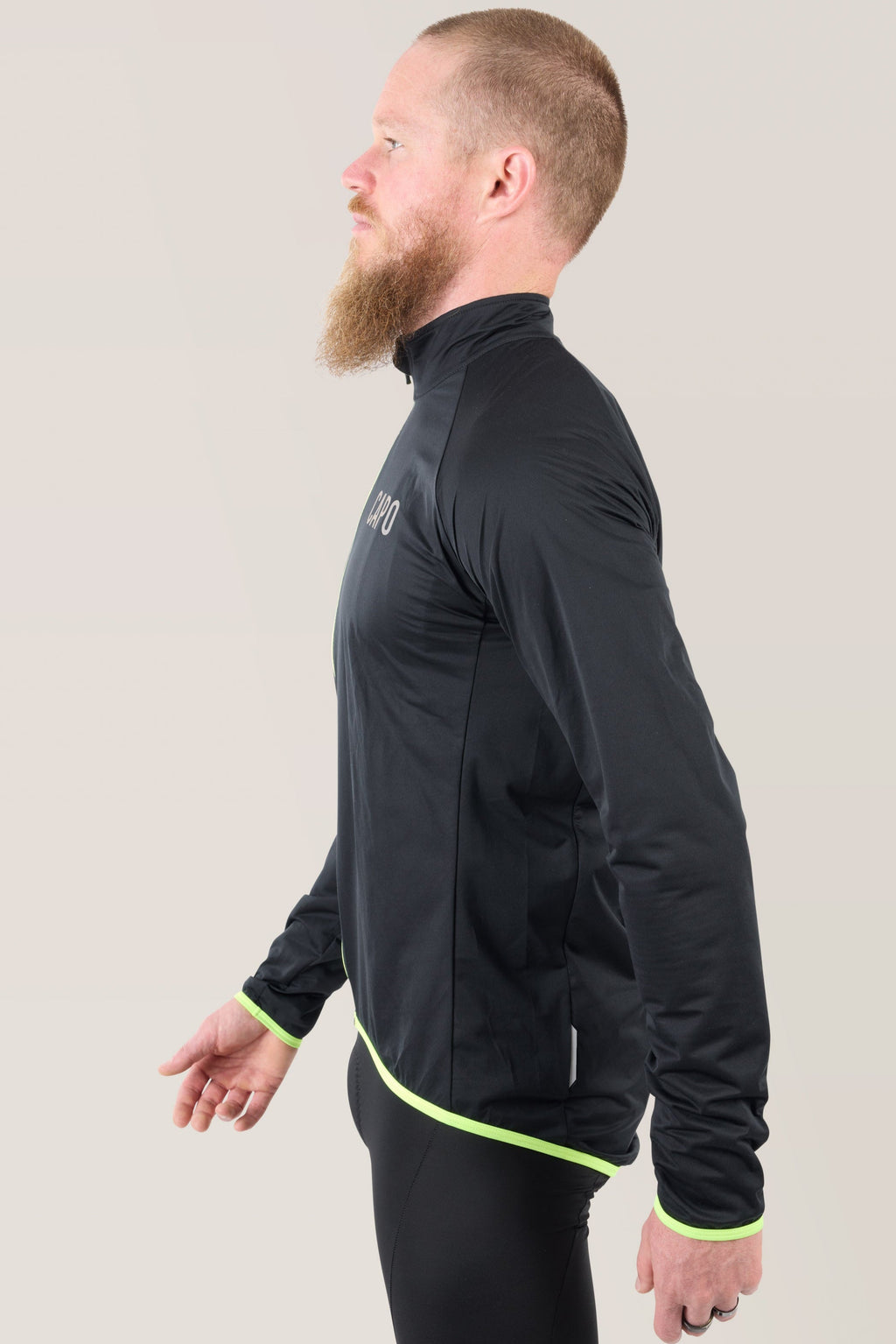 Black rain jacket with neon green piping and full front zipper, side view