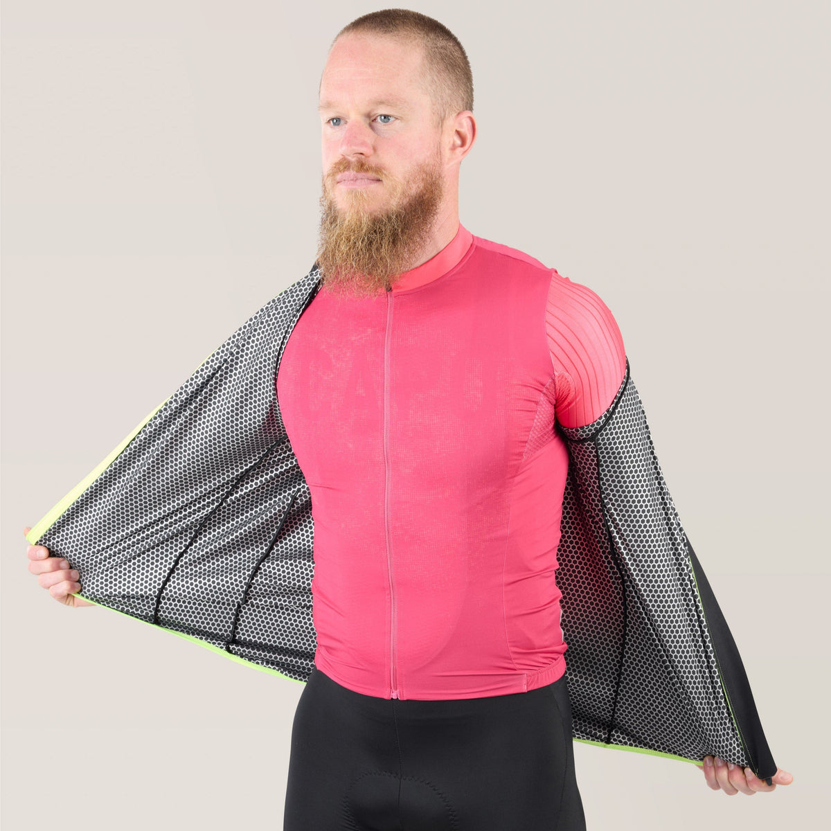 Pink rain jacket with front zipper and neon green piping, front view