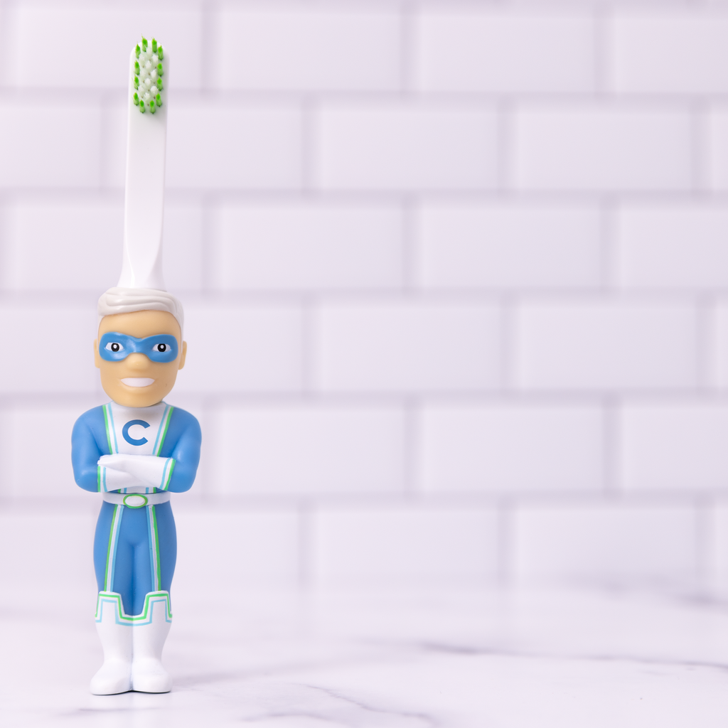 Kids character toy toothbrush with Captain Cavity figure handle and white bristle head