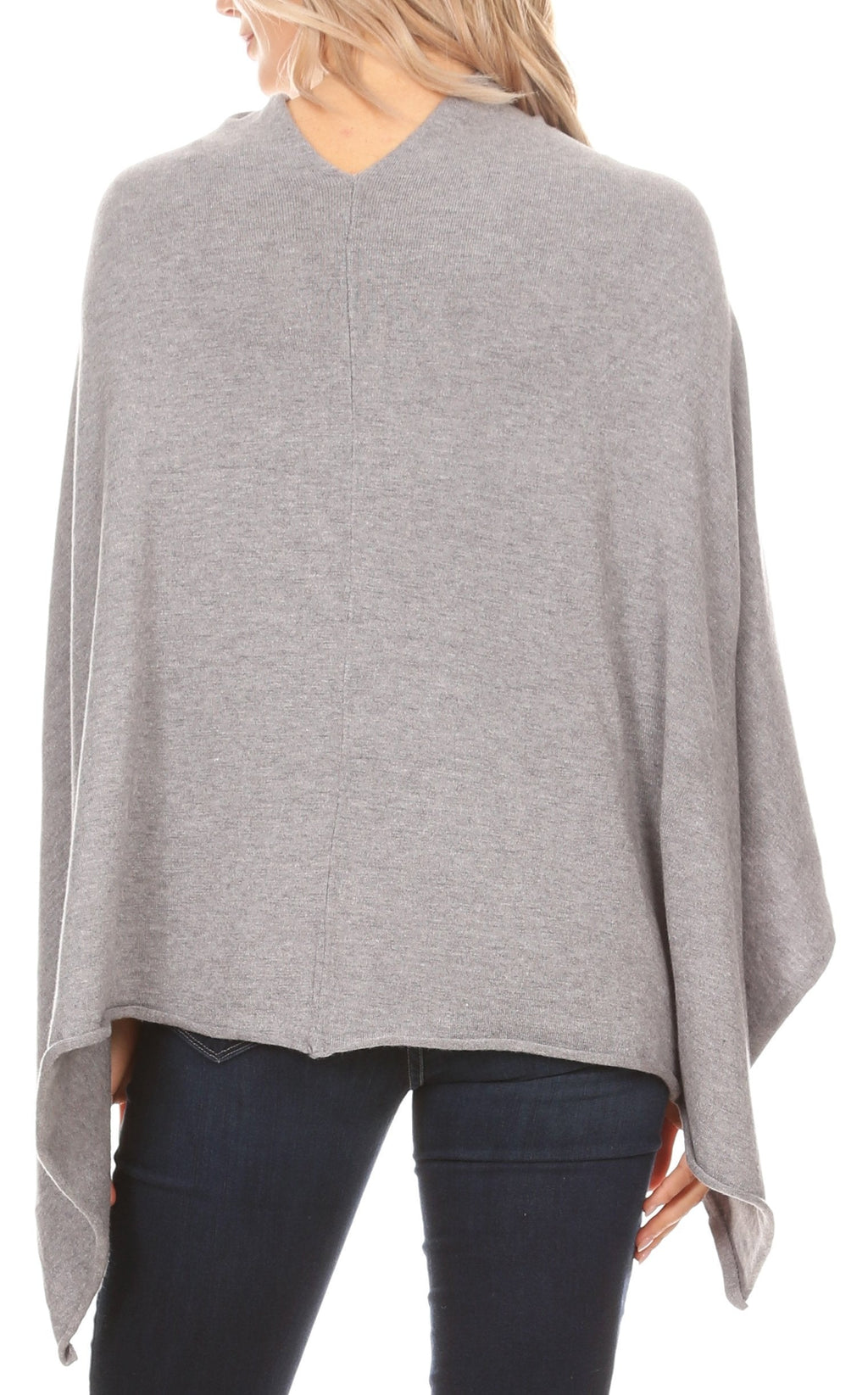 Women’s grey cape poncho with long back drape and open sides over dark jeans