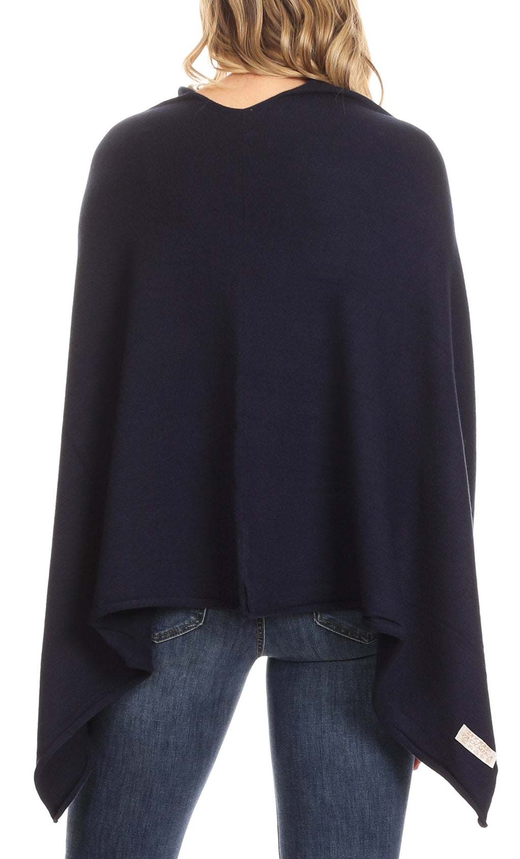 Women’s navy cape poncho with full back coverage and asymmetrical side hem over jeans