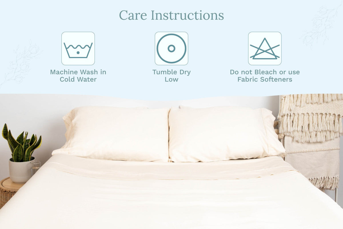 Organic sateen pillowcases on bed, light off-white color, envelope closure