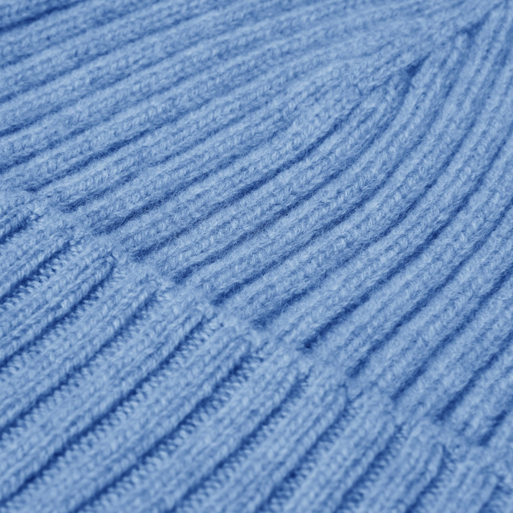 Light blue ribbed knit beanie fabric with vertical knit stripes