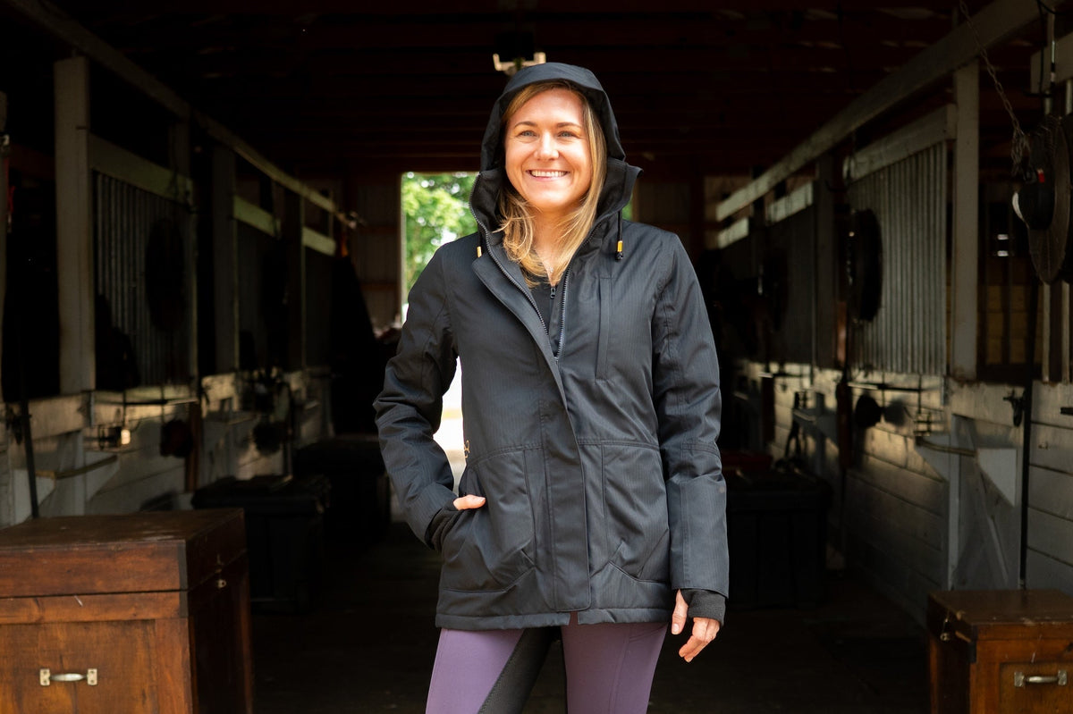 Black hooded insulated riding jacket with zip front and side pockets