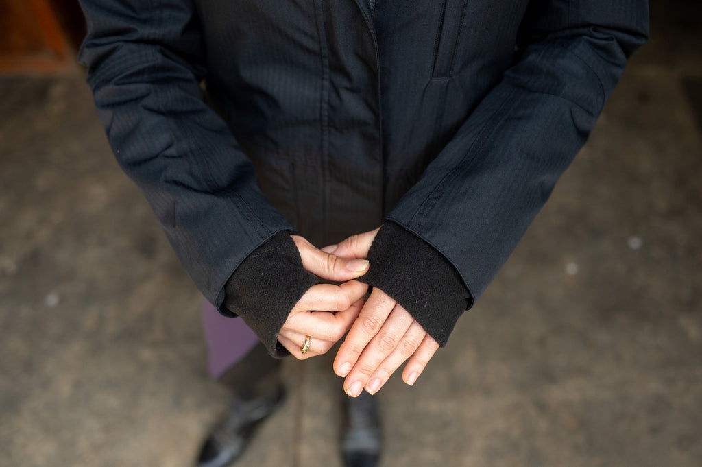 Insulated riding jacket with elastic cuffs and visible front zipper