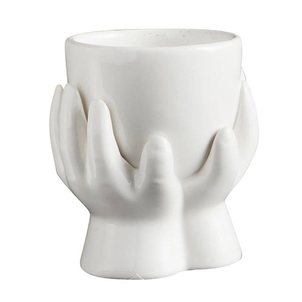 White ceramic hand-shaped planter with curved open top