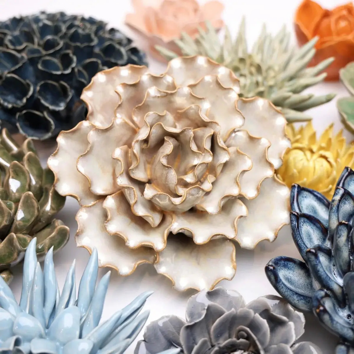 Large cream ceramic sea-lettuce flower wall art in seashell-like petal cluster