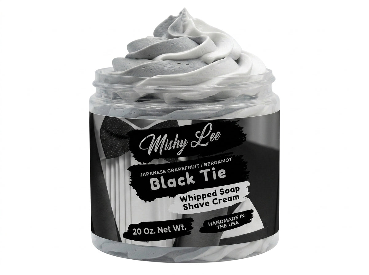 Close-up of whipped soap and shave cream jar with gray foam swirls, Black Tie label