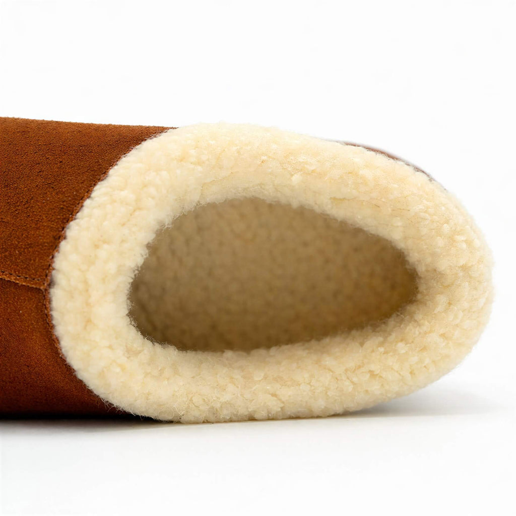 Men's Ashton slipper interior view, cream sherpa lining inside brown suede upper