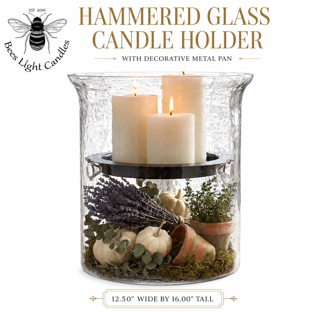Hammered glass candle holder with decorative metal pan, lit candles and autumn accents