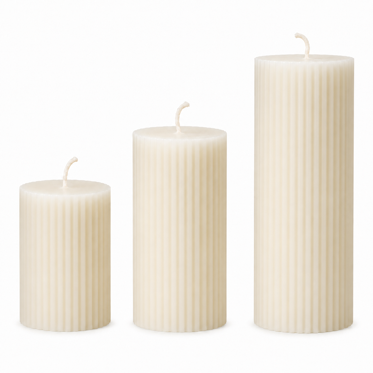Set of three white striped pillar candles with wicks, unlit