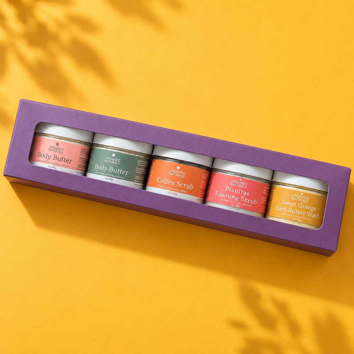Gift box with assorted body care jars: body butter and coffee scrub