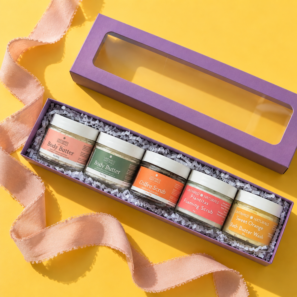 Open gift box with assorted body care jars and crinkle paper filler