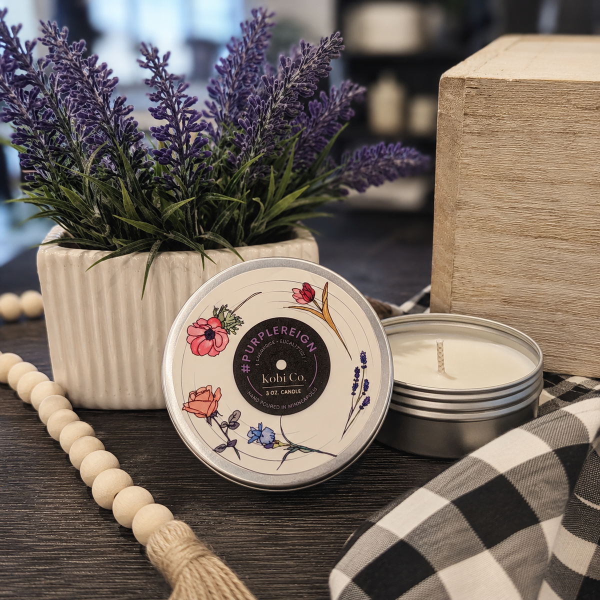 Travel tin candle with floral lid, open silver tin on plaid cloth