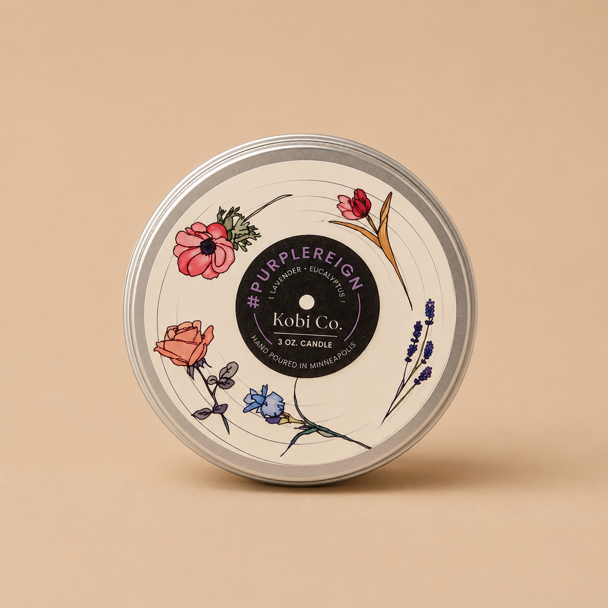 Travel tin candle with floral lid and Kobi Co label, round silver tin