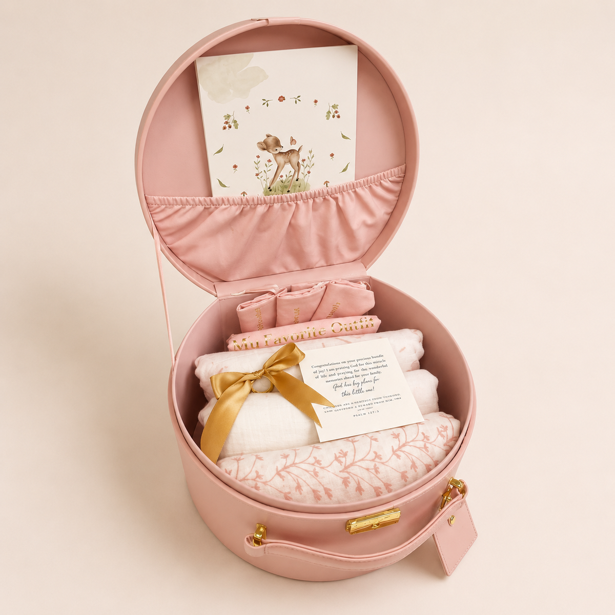 Pink keepsake take-home box with folded blanket and attached card inside
