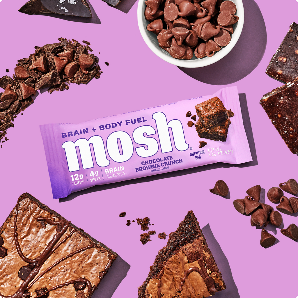 Chocolate brownie crunch protein bar with purple wrapper and small chocolate brownie pieces