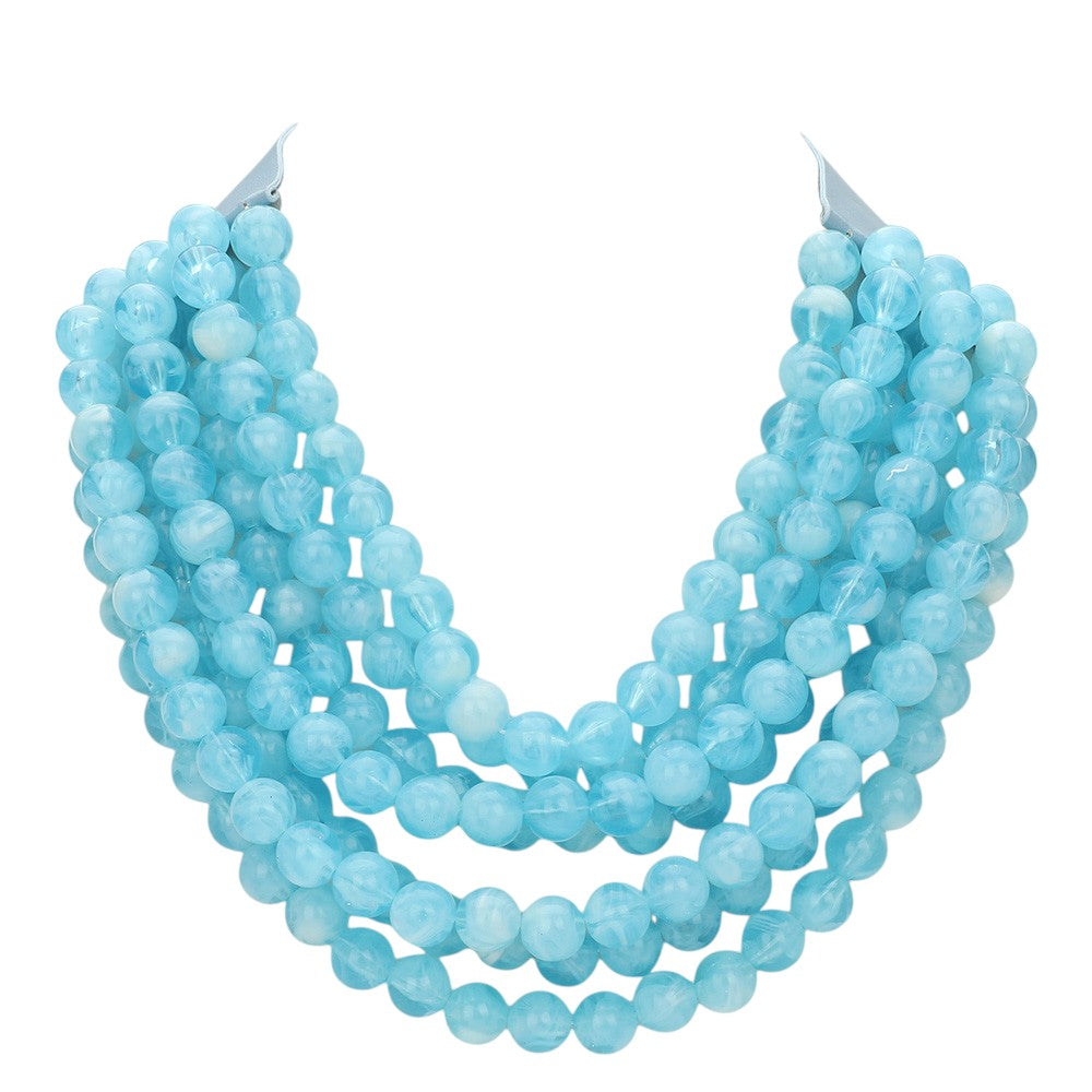 Chunky multi-strand beaded statement necklace in light blue with dense bead strands.