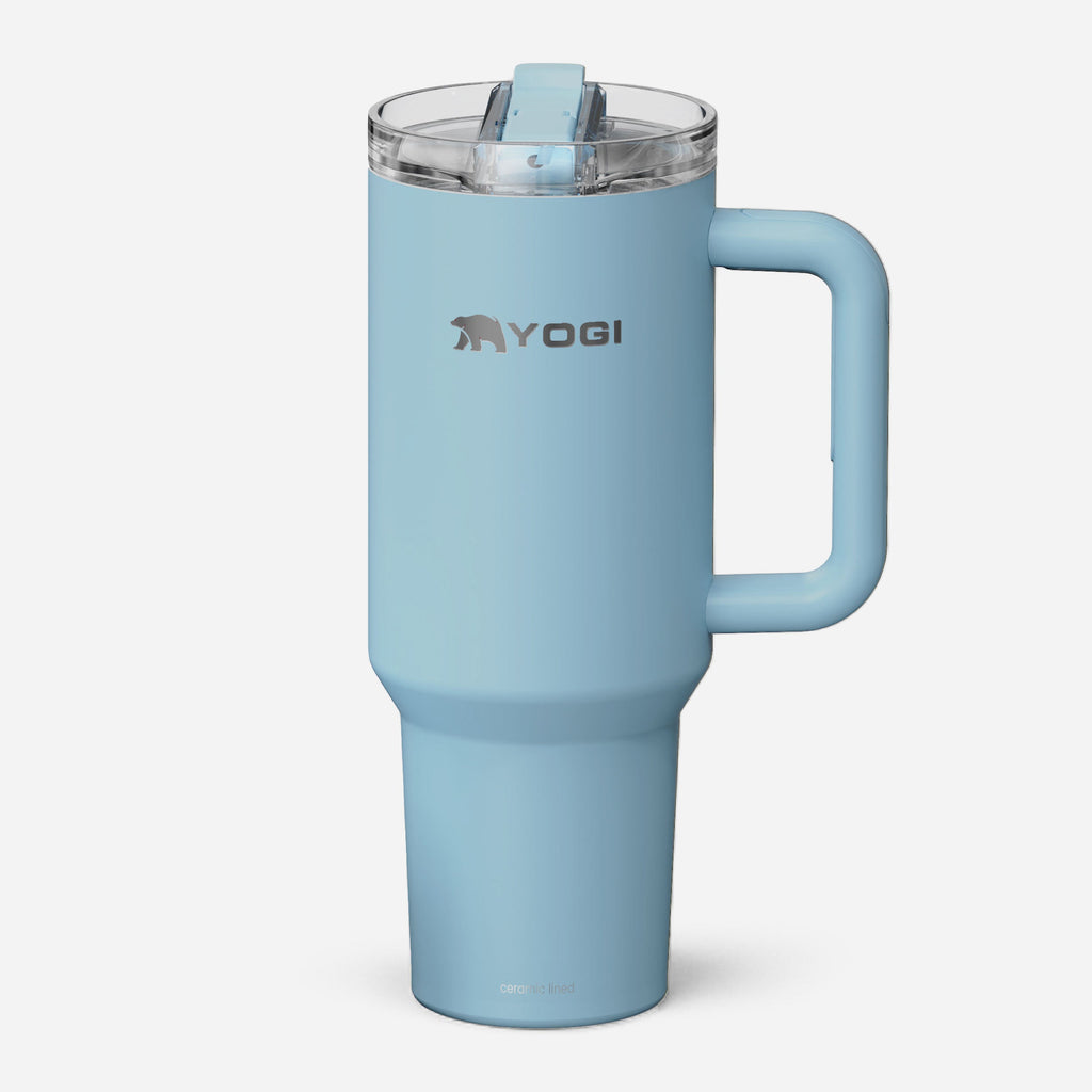 Light blue ceramic-lined evolution tumbler with clear lid and side carry handle.