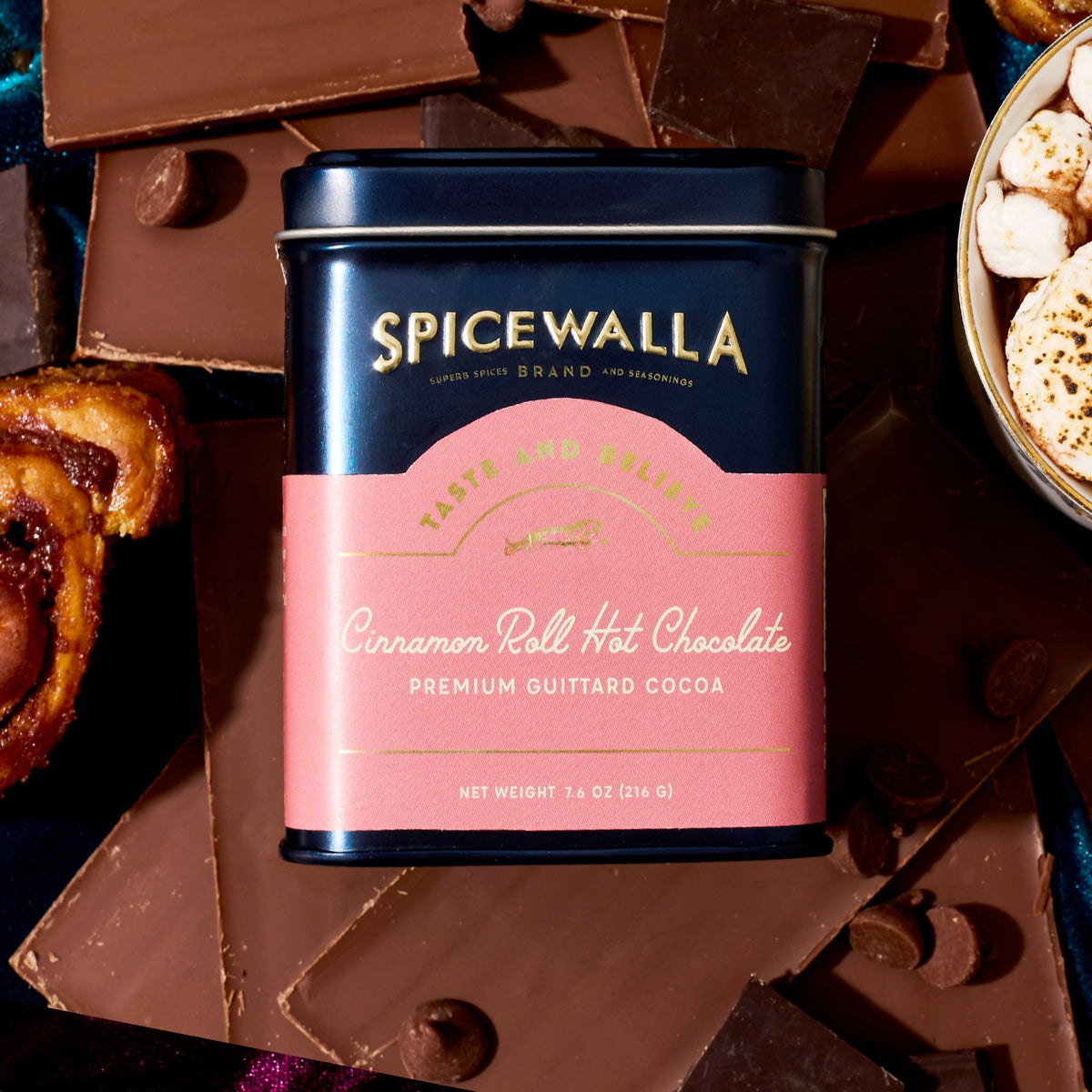 Cinnamon Roll hot chocolate cocoa tin with dark blue lid and pink label
