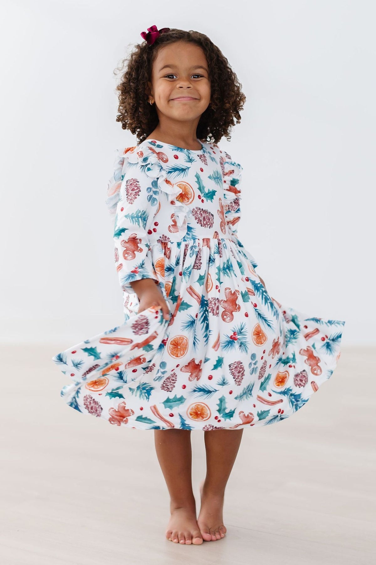 Kids Christmas print twirl dress with 3/4 sleeves and full flared skirt, white background