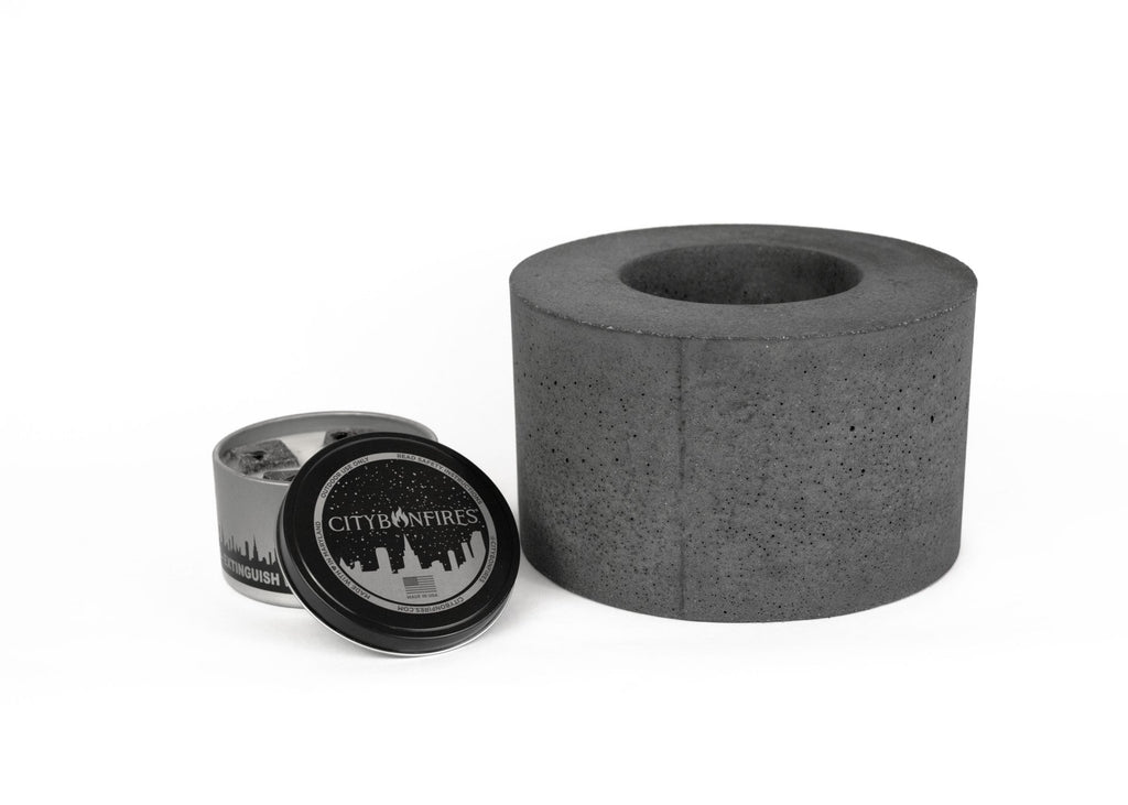 Dark gray concrete fire pit with open bowl and black burner cover