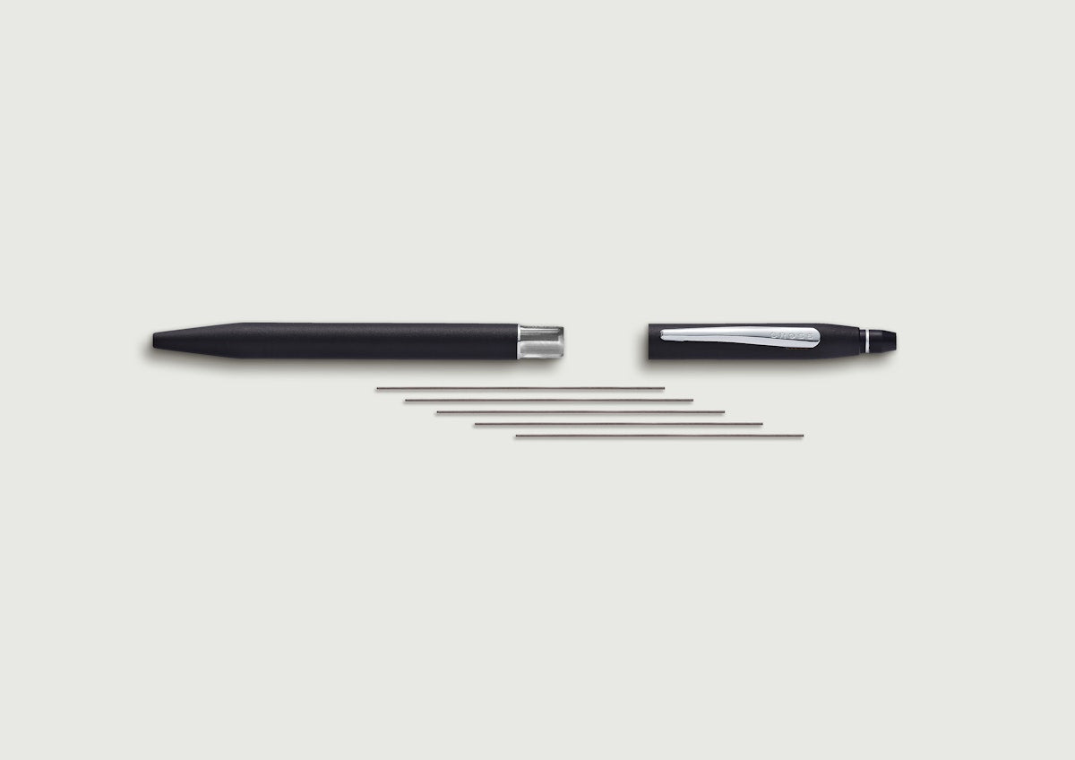 Ballpoint pen and pencil gift set parts: black barrels, silver refills, caps