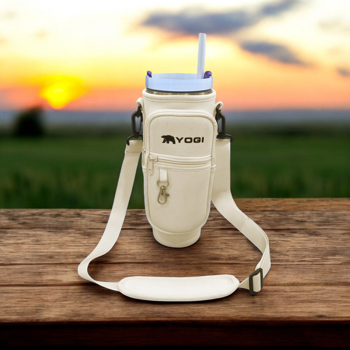 Cream crossbody tumbler tote with front zip pocket and adjustable shoulder strap