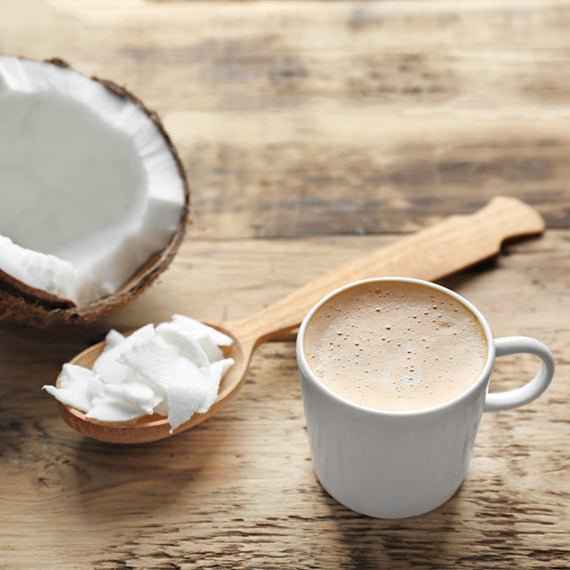 Coconut pumpkin latte scented fragrance oil, with creamy latte in a cup